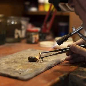 jewelry-maker-working-alone-atelier